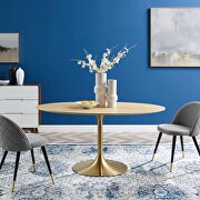 Oval wood dining table in gold natural
